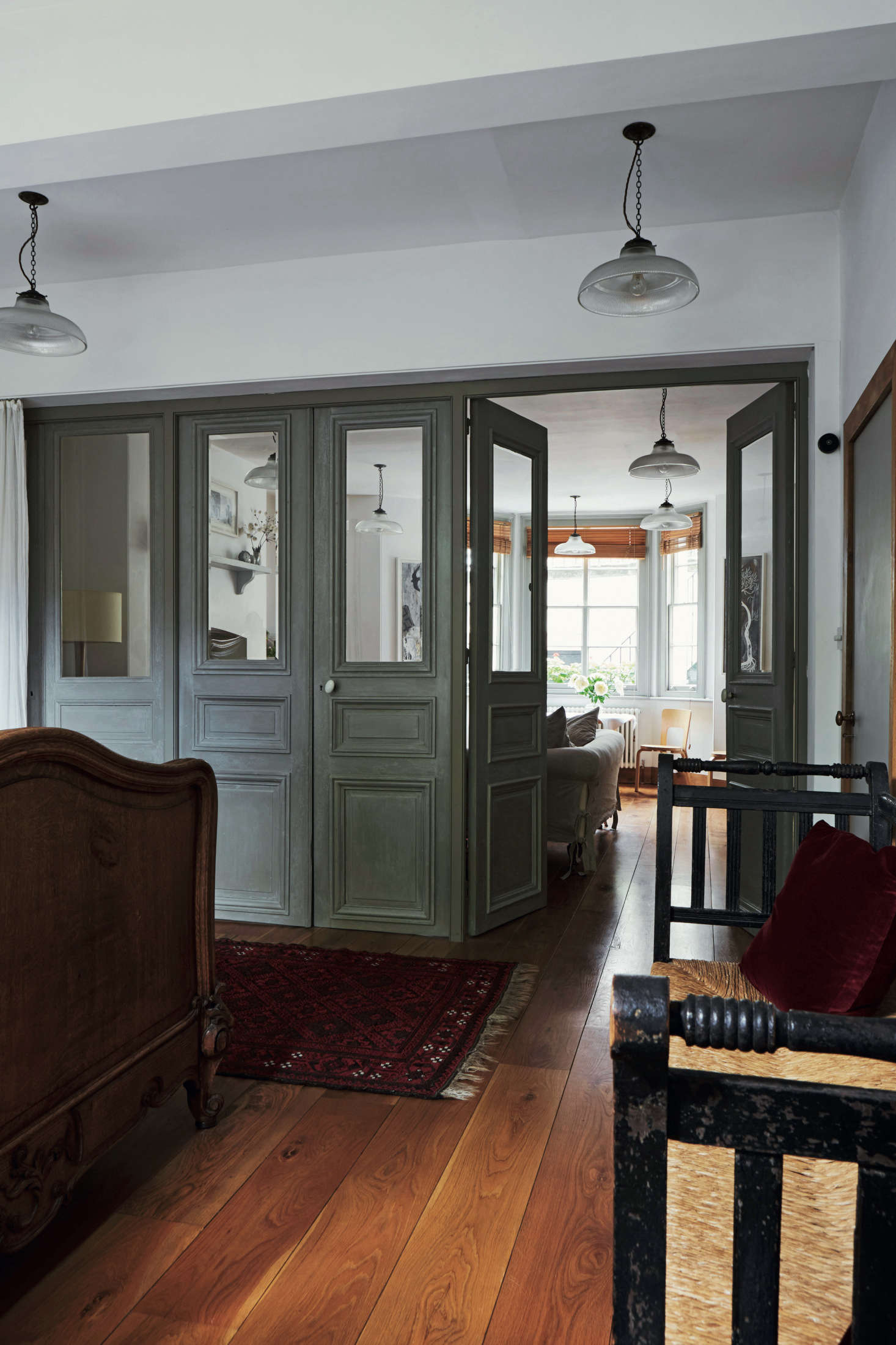The couple completely overhauled the garden-level basement and turned it into a vacation rental: it’s available as The Atelier, York via Sawday’s for £130 a night. The front sitting room is divided from the bedroom by 18th-century château doors that came from a local antiques dealer friend and allow sunlight to travel through the space.