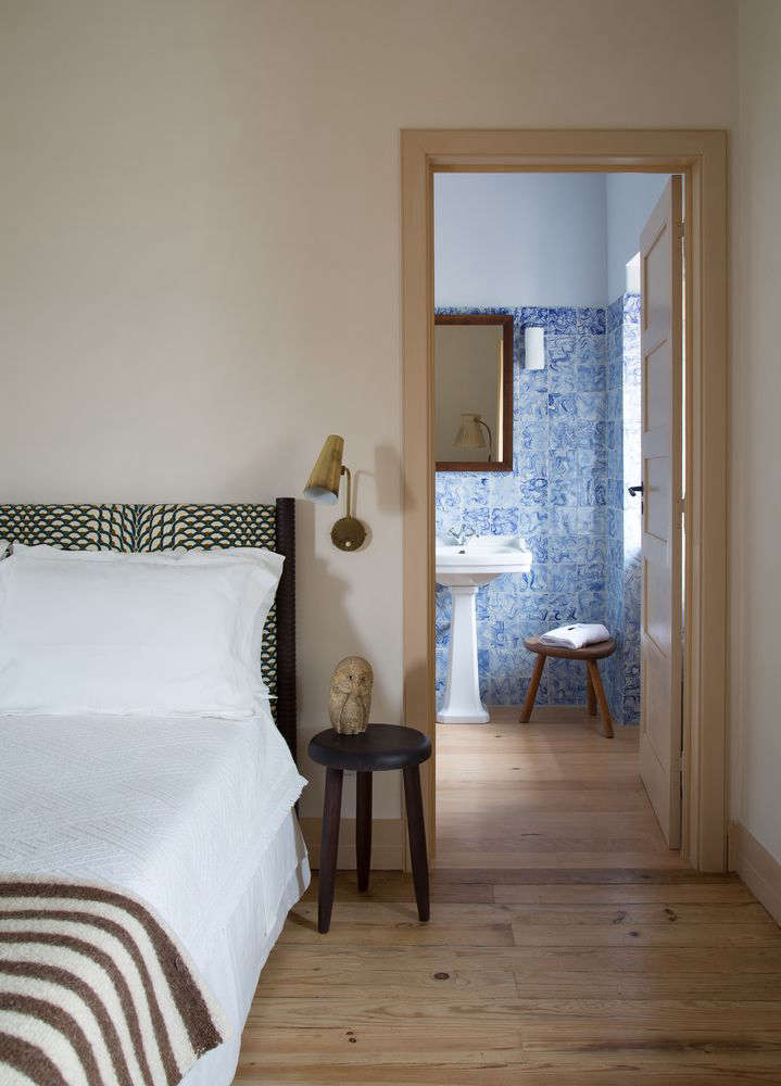 A glimpse into a tile-clad guest bathroom.