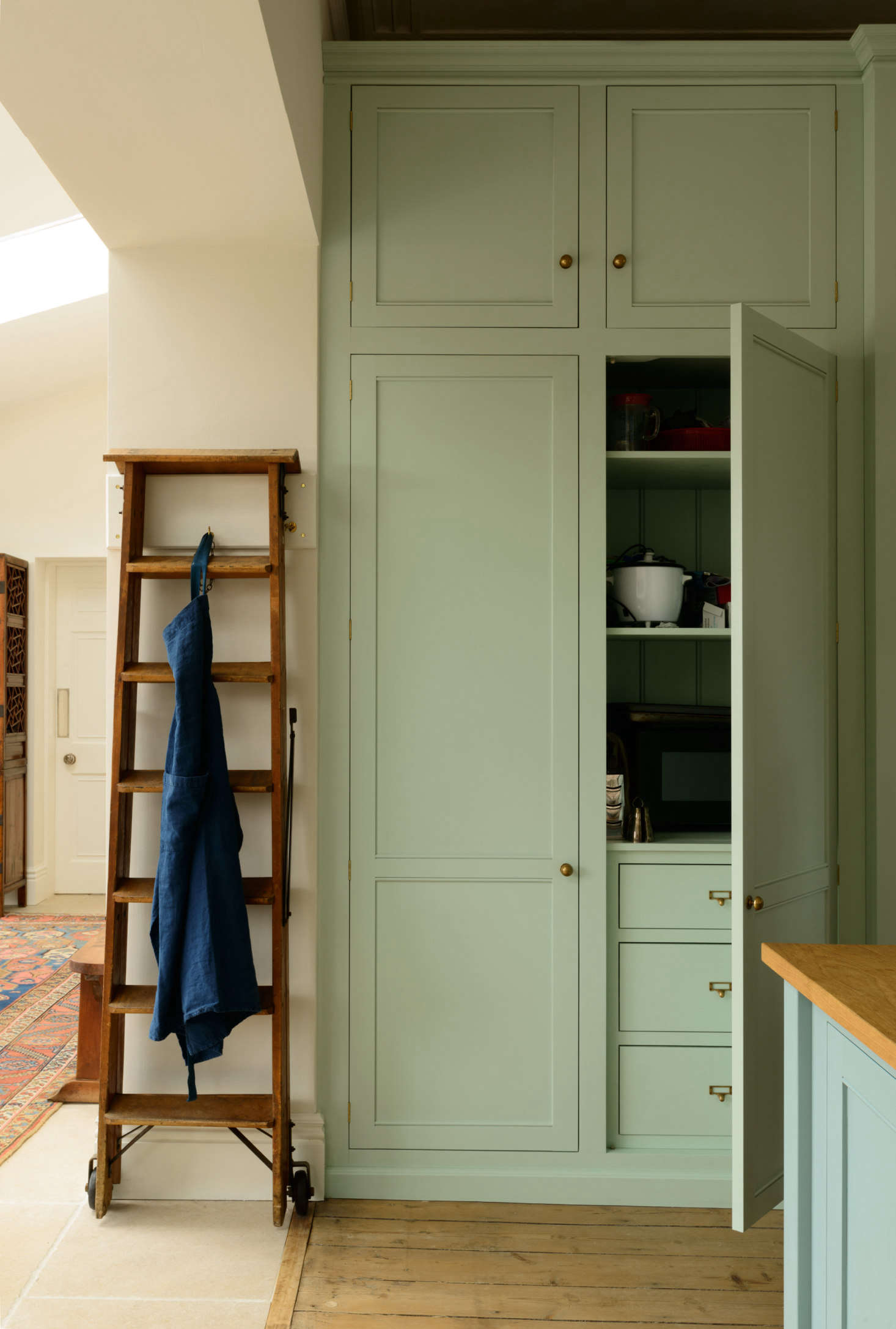 The appliance cupboard holds the microwave, among other things. The antique Belgian library ladder came from 23-year-old local antiques dealer Matt Dixon of Tallboy Interiors, whom Margot discovered on Instagram: I gave him my wishlist and he came up with a number of the items at very fair prices.