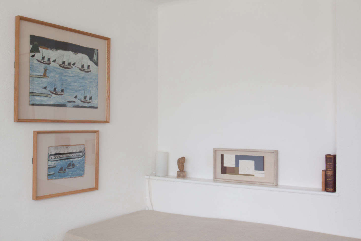 Propped on the shelf next to the twin bed is the Ben Nicholson 4data-src=