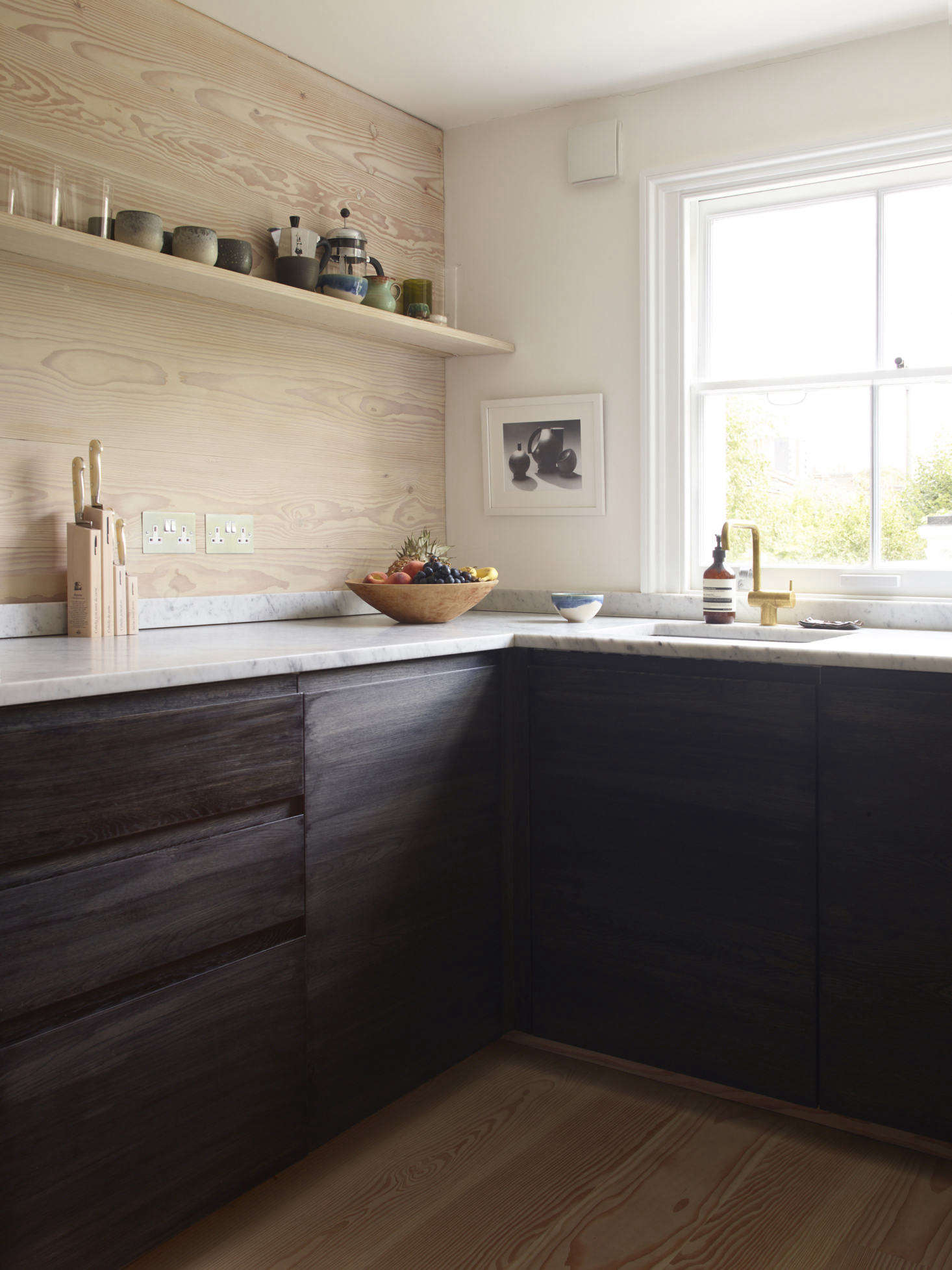 For a splurge, the couple opted for a Vola faucet and Carrara marble countertops. (For more on Carrara, see Remodeling data-src=