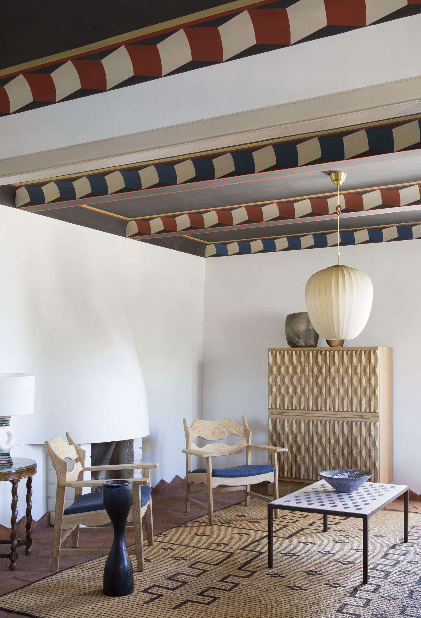 Plenty of empty space and unadorned walls keep the room from feeling too busy.