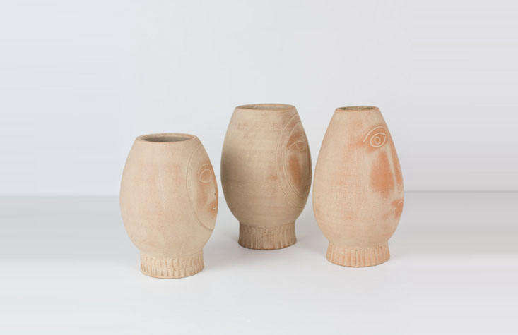 The pots, sleuthed; a set of three Clay Face Pots are $90 from At West End.