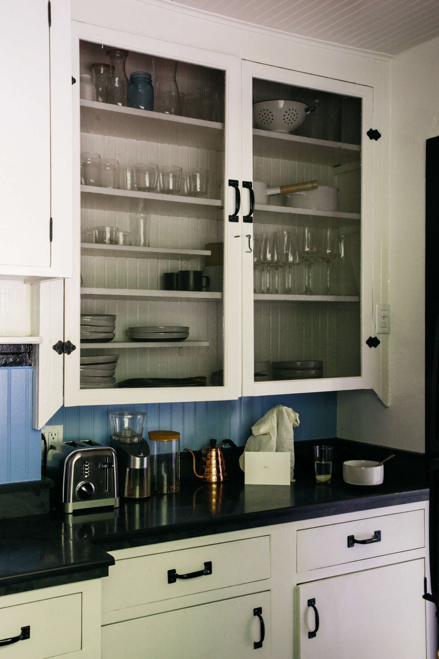 The couple makes good use of the cabinets the rental came with: they