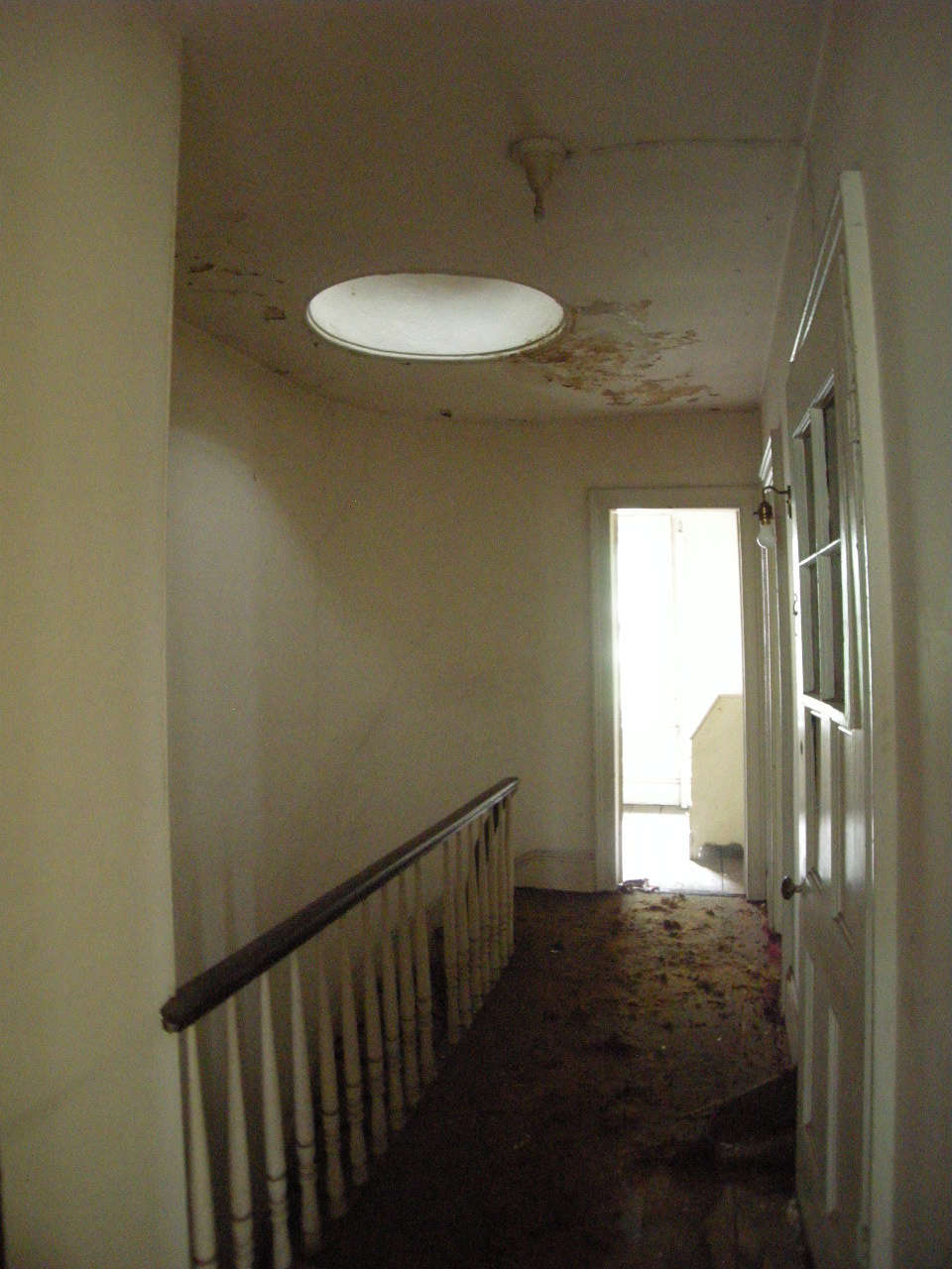 The top floor hall with skylight and banister that’s still in use.