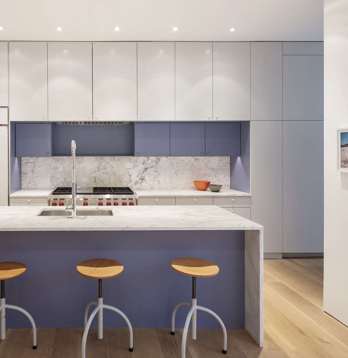 High on the clients’ wish list was a hard-working kitchen (Sam used to be a chef). The gray and purple cabinets were made by ABR Molding, a general contractor that O’Neill frequently works with. “We’re always trying to find color to make a space special. We don’t coat the whole project in color, just single moments,” says O’Neill. The faucet is by Dornbracht.