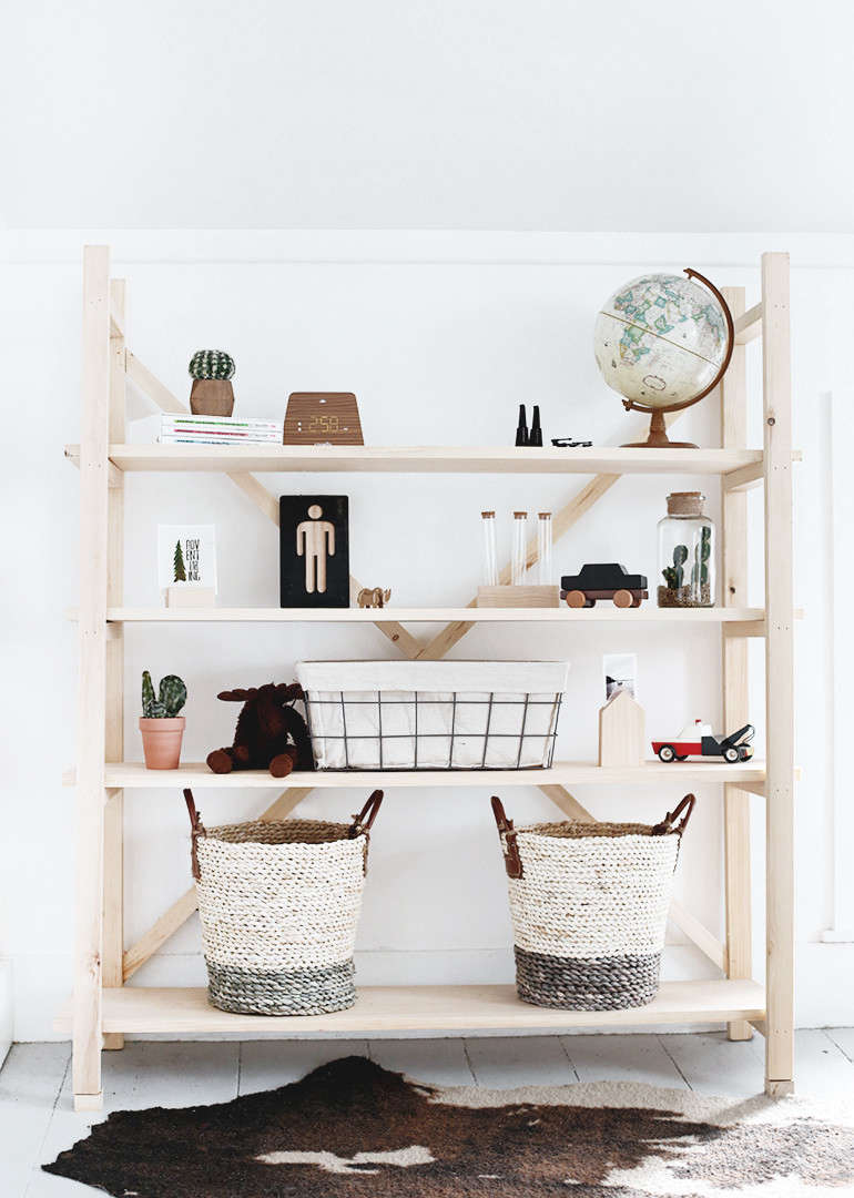 Manda and Caitlin describe their DIY Wood Bookshelf as “scaffolding style.” It was inspired by Anthropologie’s Toscana Bookcase.