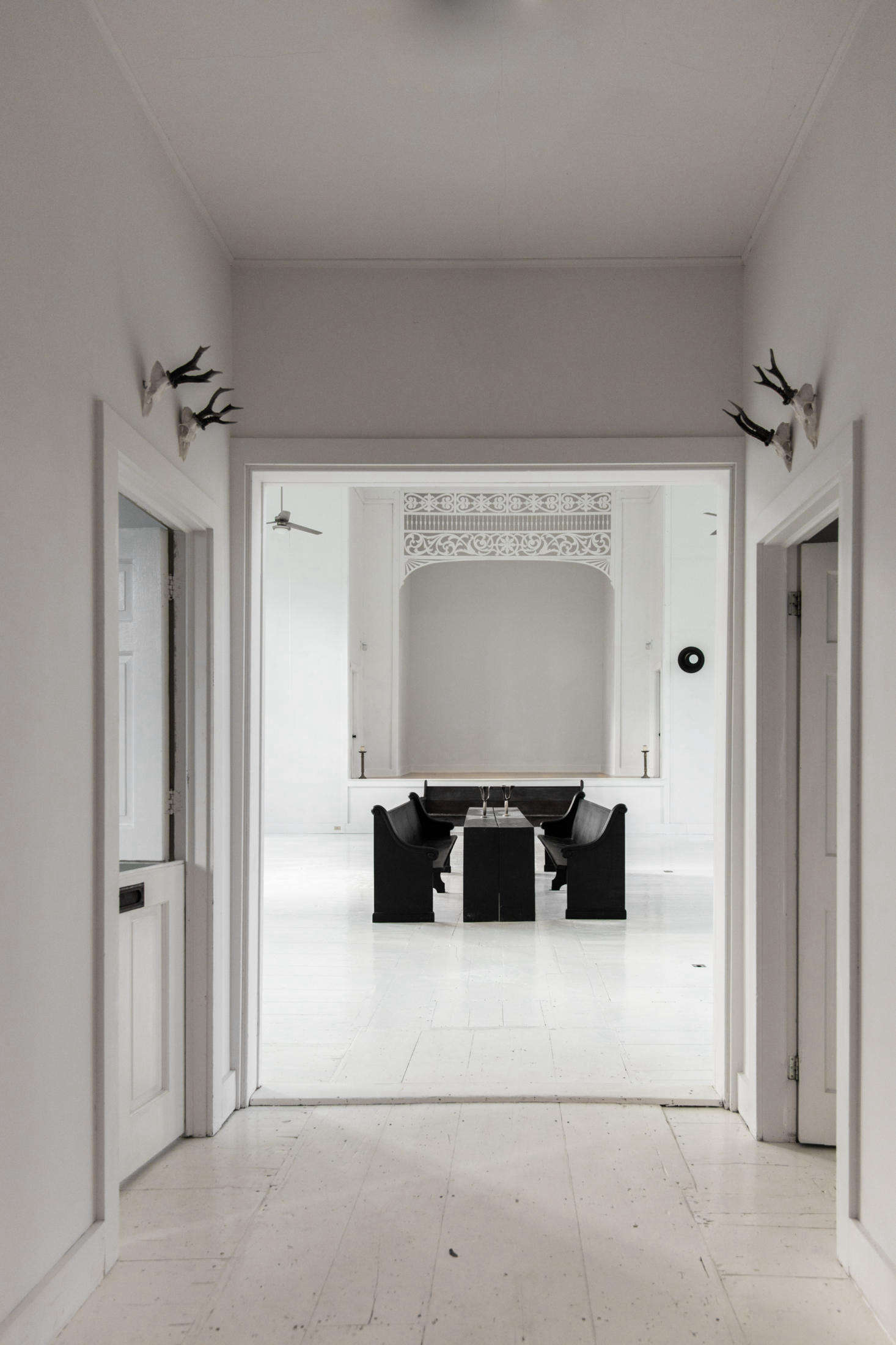Stepping into the church, with bedrooms to the left and right, and the main room straight ahead.