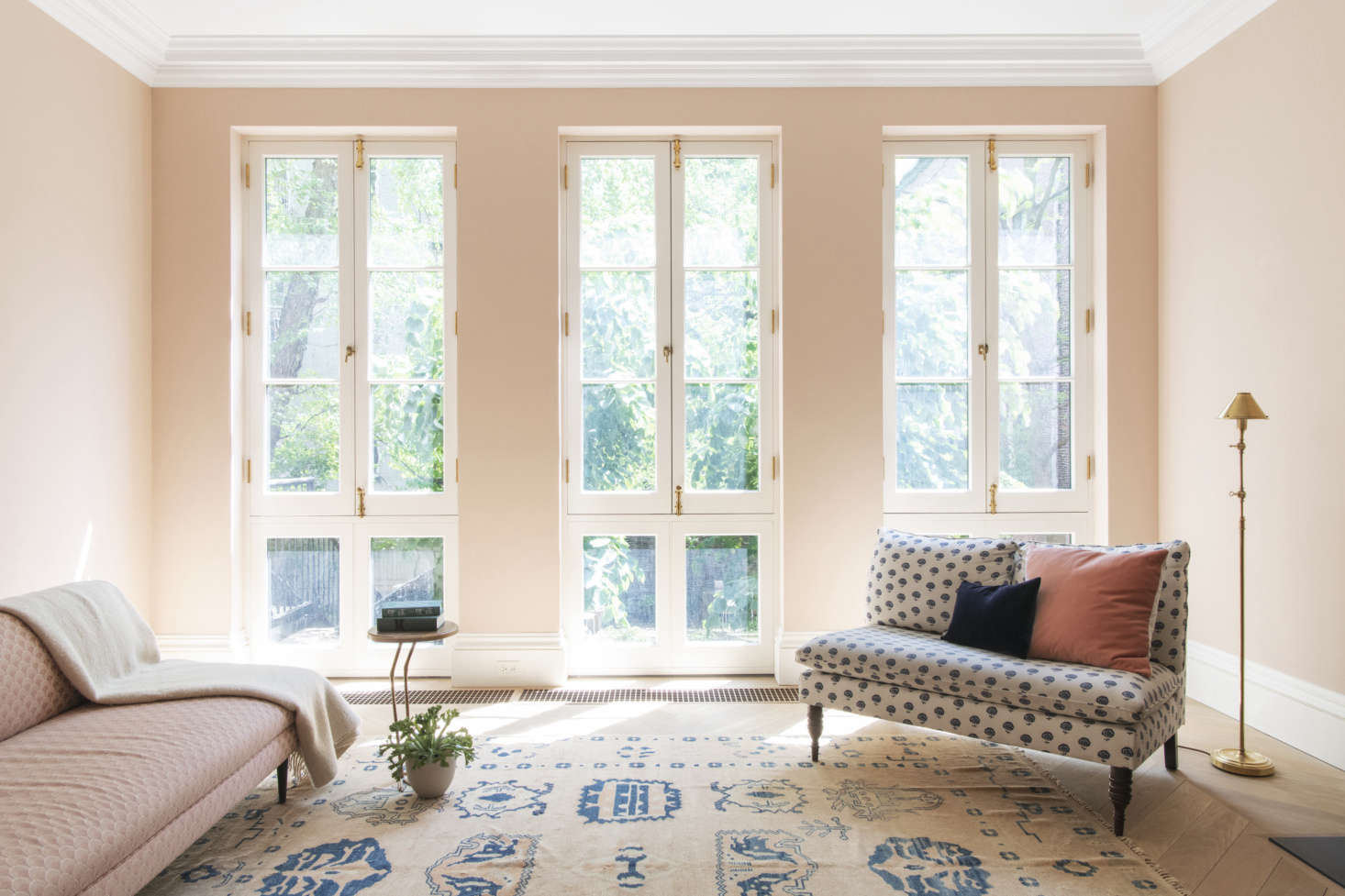 “Our client really wanted the final product to feel like an intact 19th century townhouse that had been minimally updated,” says Lekwa. The south-facing parlor floor is painted Greville, a pink by Adam Bray of London (see Bespoke Color from an Accidental Decorator) and has baseboards that are reproductions of the originals.