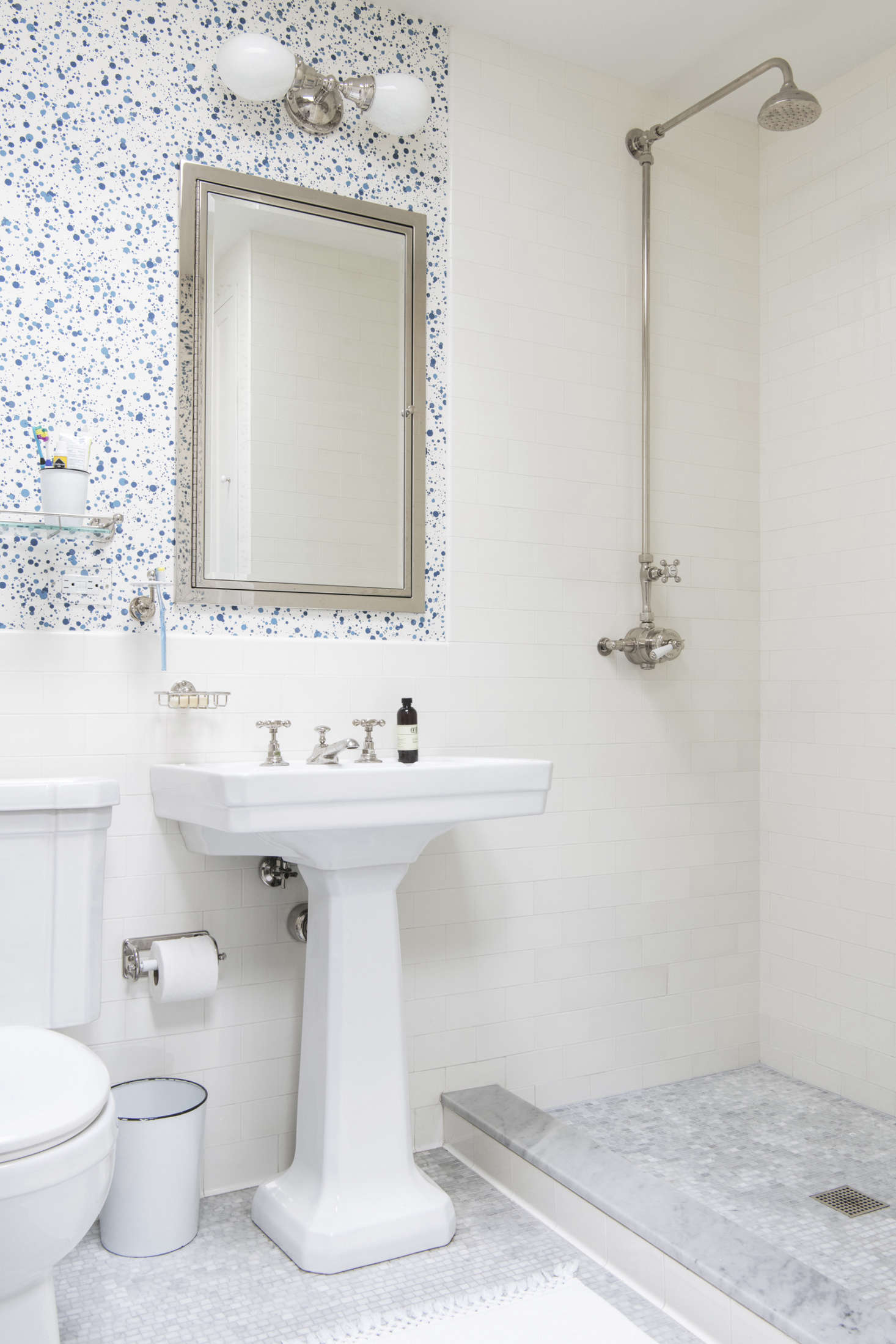 Spatter wallpaper in another children’s bath. The Framed Medicine Cabinet is from Restoration Hardware—a more more affordable version of the Urban Archaeology’s Lenox Cabinet,” says the owner.