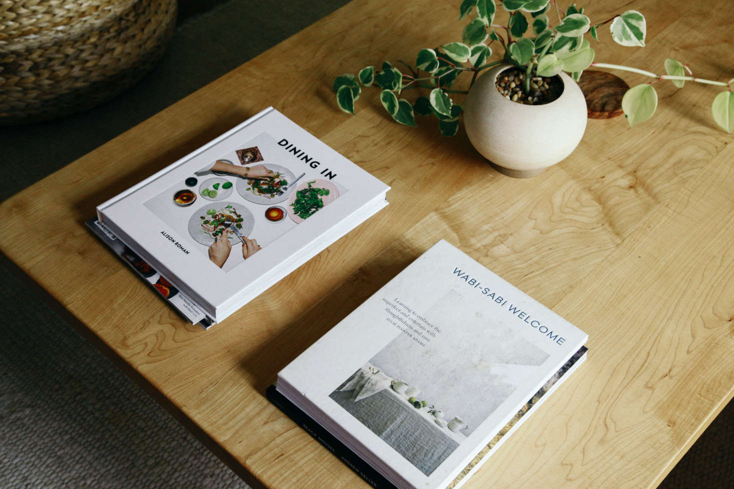 Jodi keeps a few books out on her coffee table and sideboard that reflect her interests and style. In the kitchen, all of the cookbooks are stashed on top of the refrigerator for easy reach.