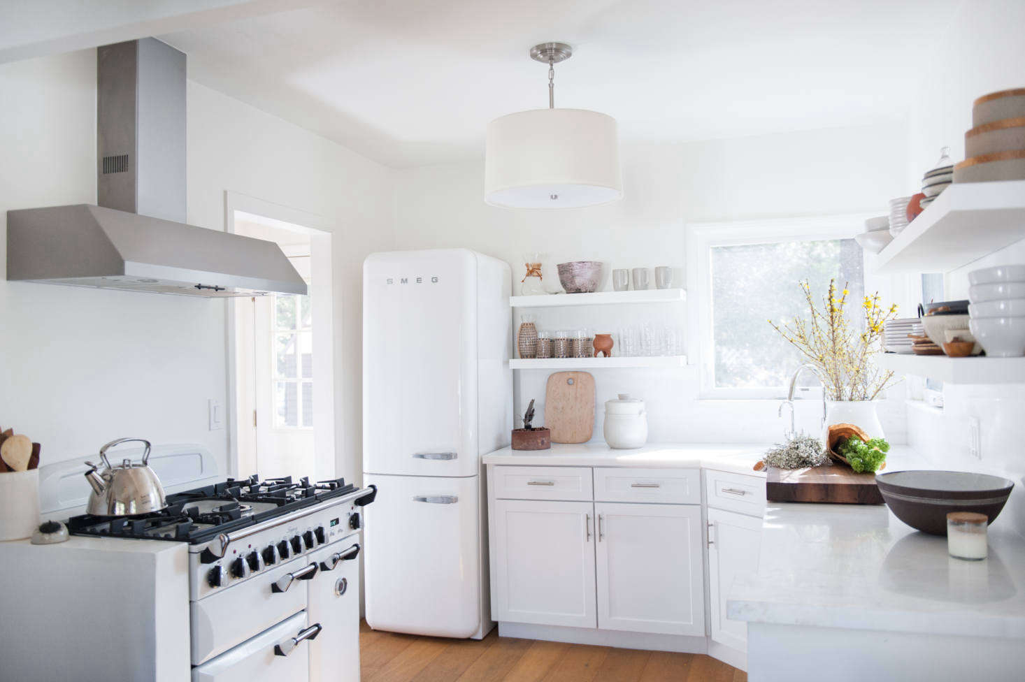 “Michael and I both grew up in England, which explains our appliance choices,” Leanne tells us. The fridge is a Smeg—”it has an old-fashioned look that we love”—and the range is an Aga.