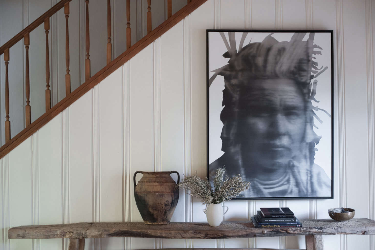 As a cabin-y contrast to the whitewashed beadboard, the stairs and rail were kept natural.