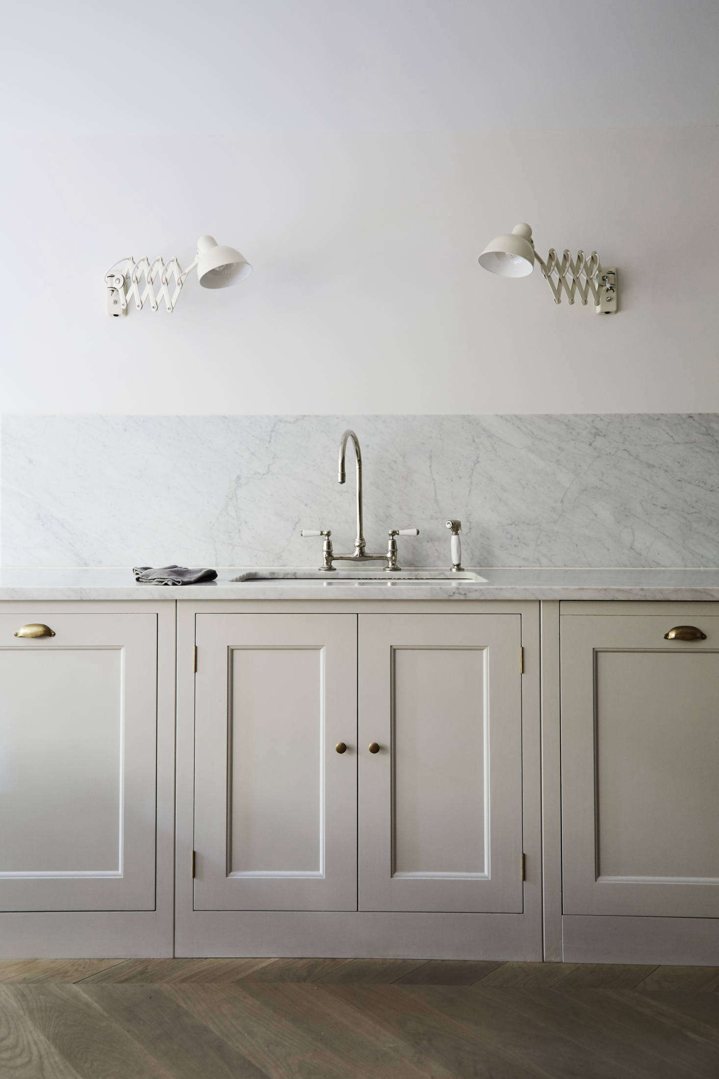 The counters are topped with Carrara marble that continues as a backsplash. All of the faucets throughout the house are Barber Wilsons designs—and like the kitchen, the owner had them sent from London: “You can get them in this country but I went to Holloway’s of Ludlow. Even with shipping, I paid considerably less.” (During installation, their crew consulted with the “very knowledgable” Barber Wilsons customer service team based in Riverhead, New York.)