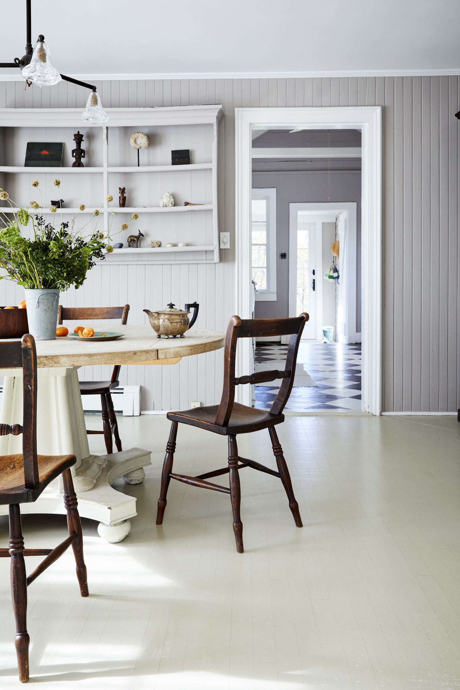 The floors throughout the rest of the house are painted white: 