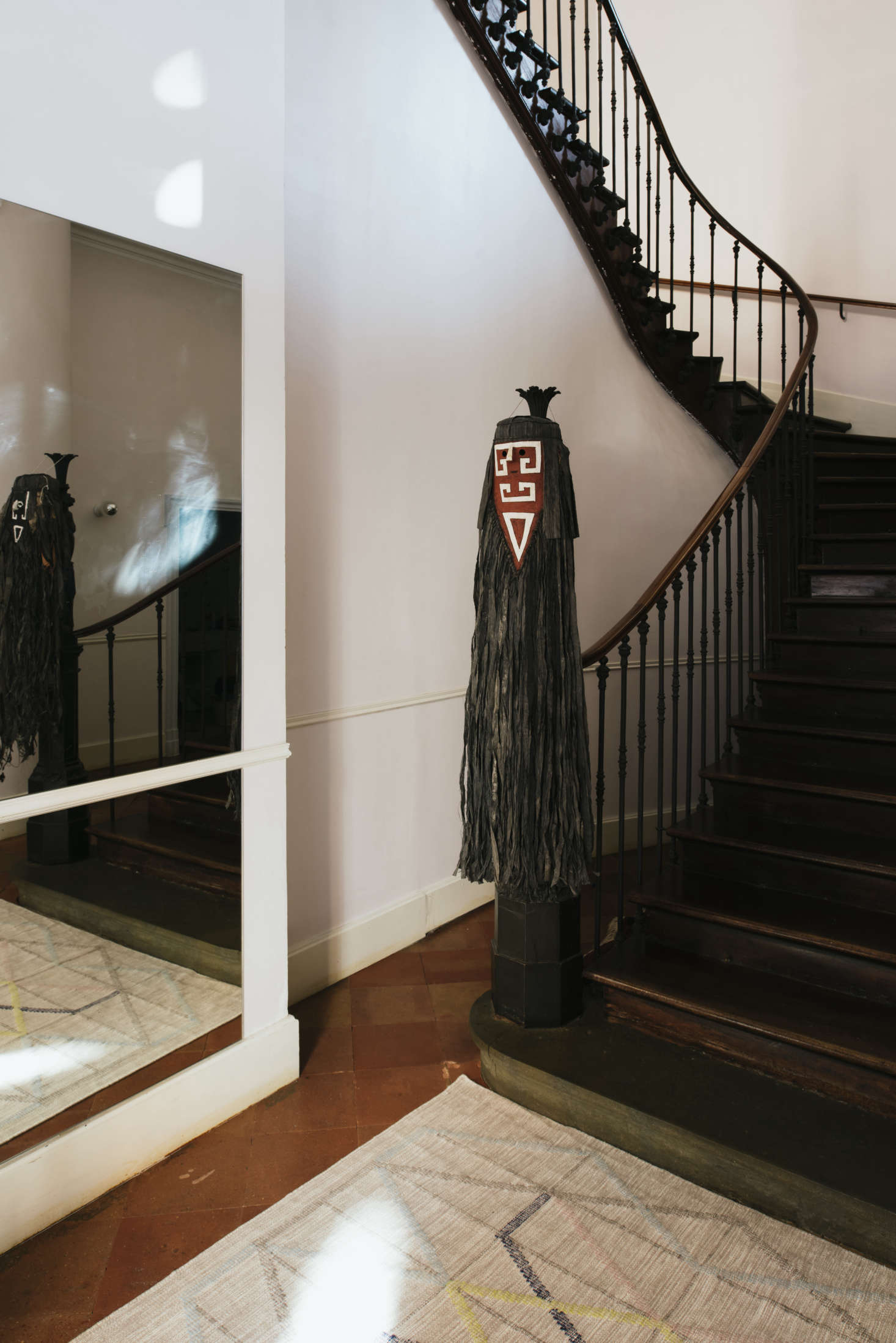 Hanging from the banister is a Tamok mask. “They come from Amazonia, Guyana, made by the Wayana,” Sathal says. “It was Christophe who brought them back after a trip to Guyana, because he is a director and wrote a play with a young Wayana woman.”
