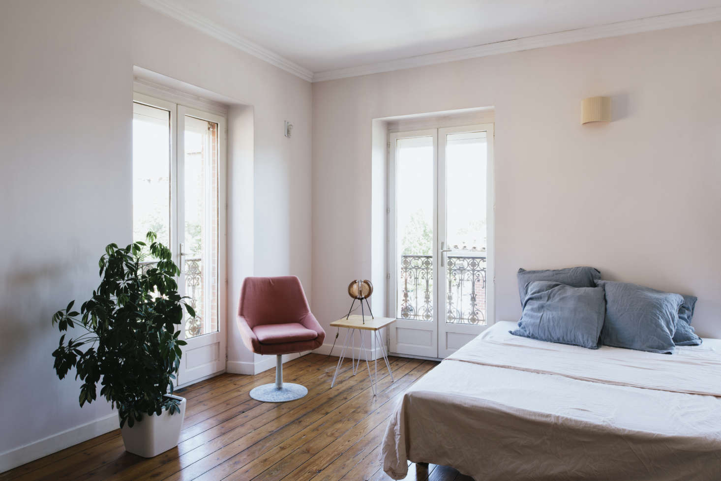 The bedrooms are fitted simply, with handmade linens and an unexpected lamp or chair.