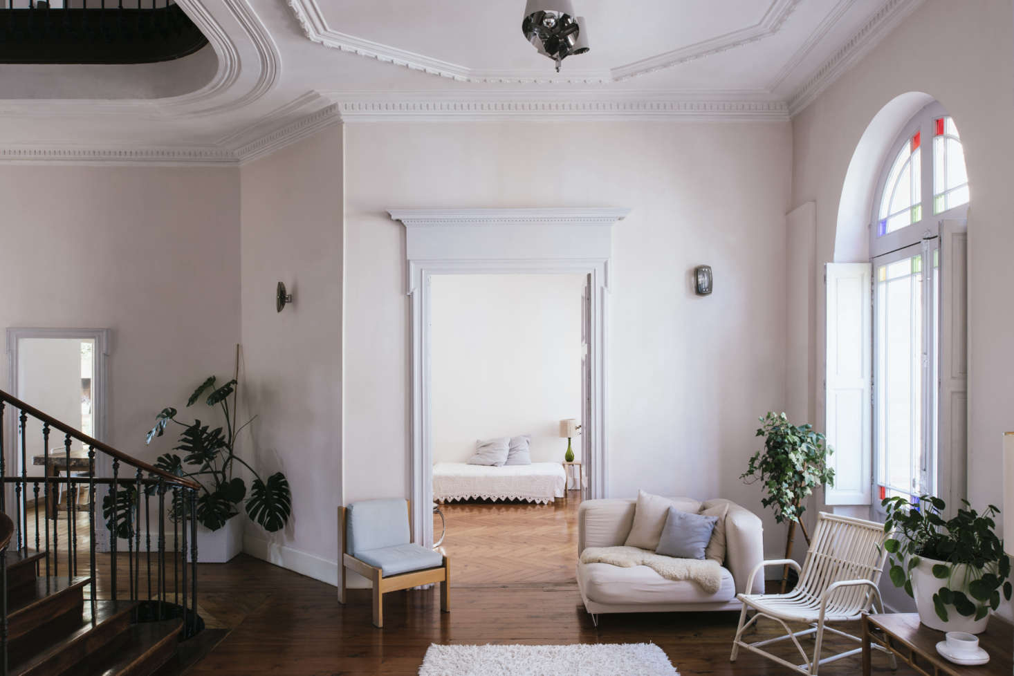 “The pastel painted walls were already there and I liked their weathered side,” Sathal says of the pale pink walls. “The trim is typical of the style of the house and is original.”