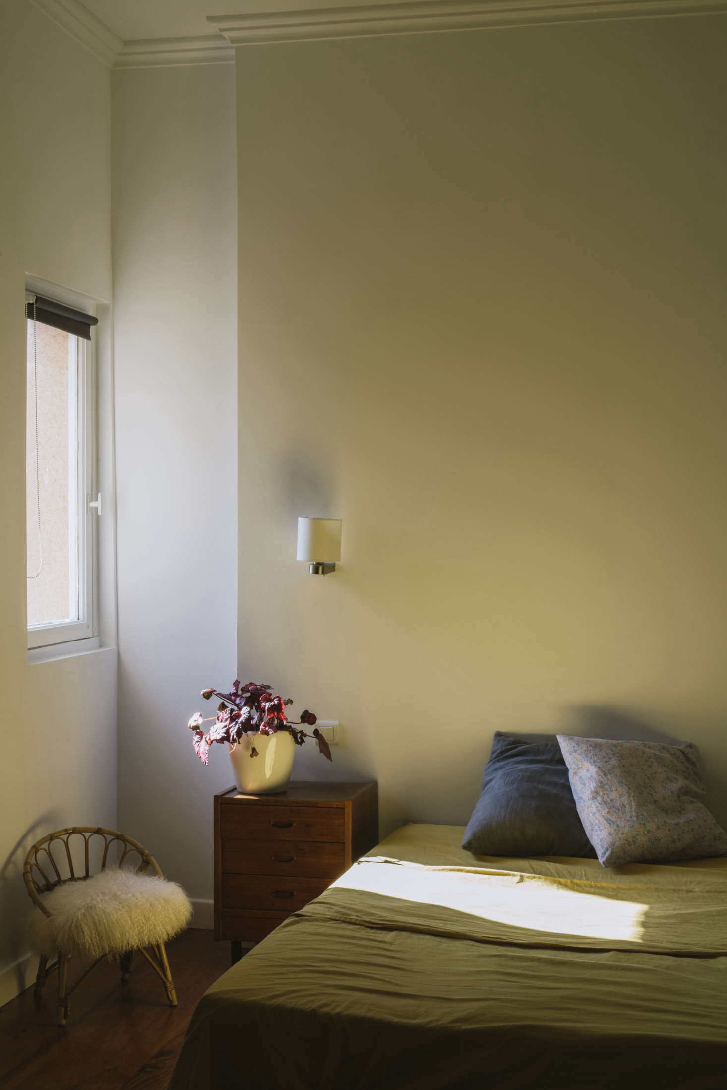 A sheepskin in another sunlit bedroom.
