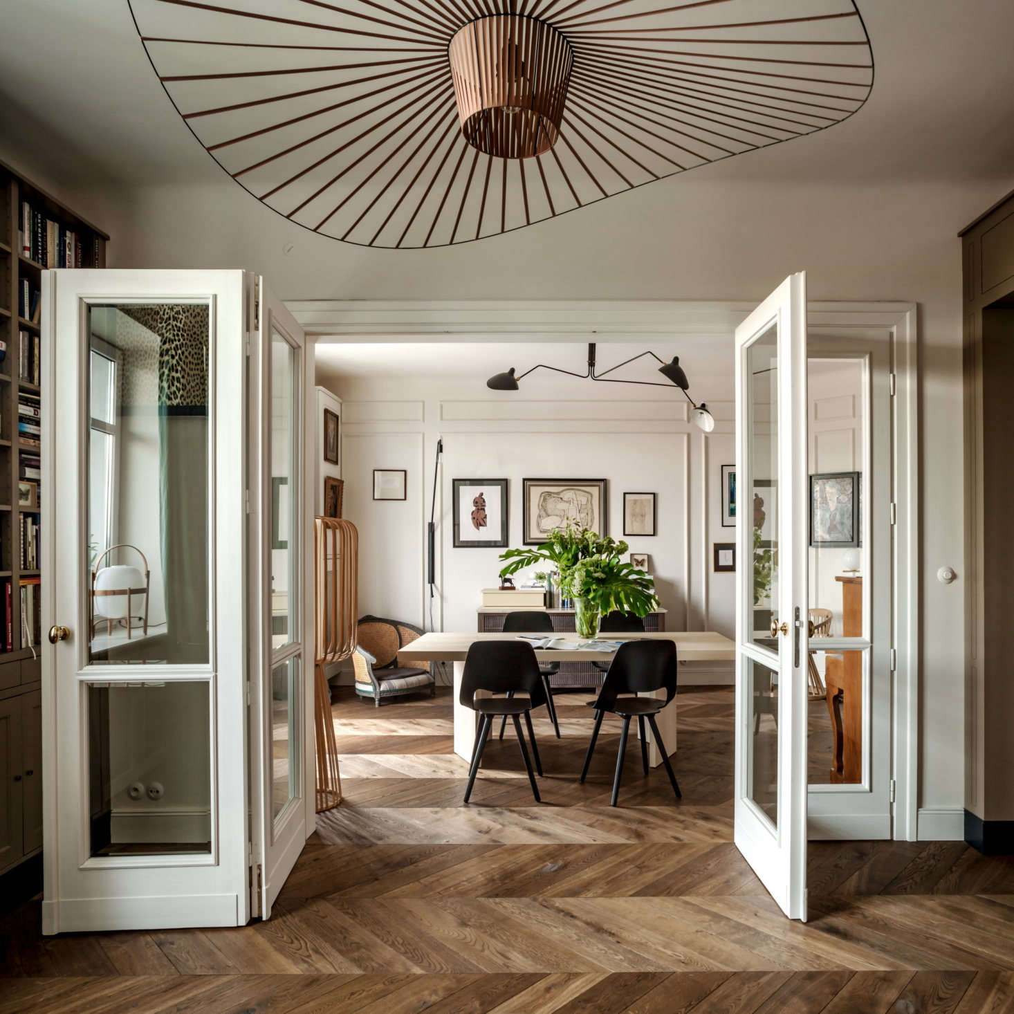 Chrapka designed the folding doors between the dining and living rooms. “Traditional pieces are usually the fixed ones such as doors, handles, and molding, but I think there is no rule when it comes to . The only key is aesthetics,” she says.