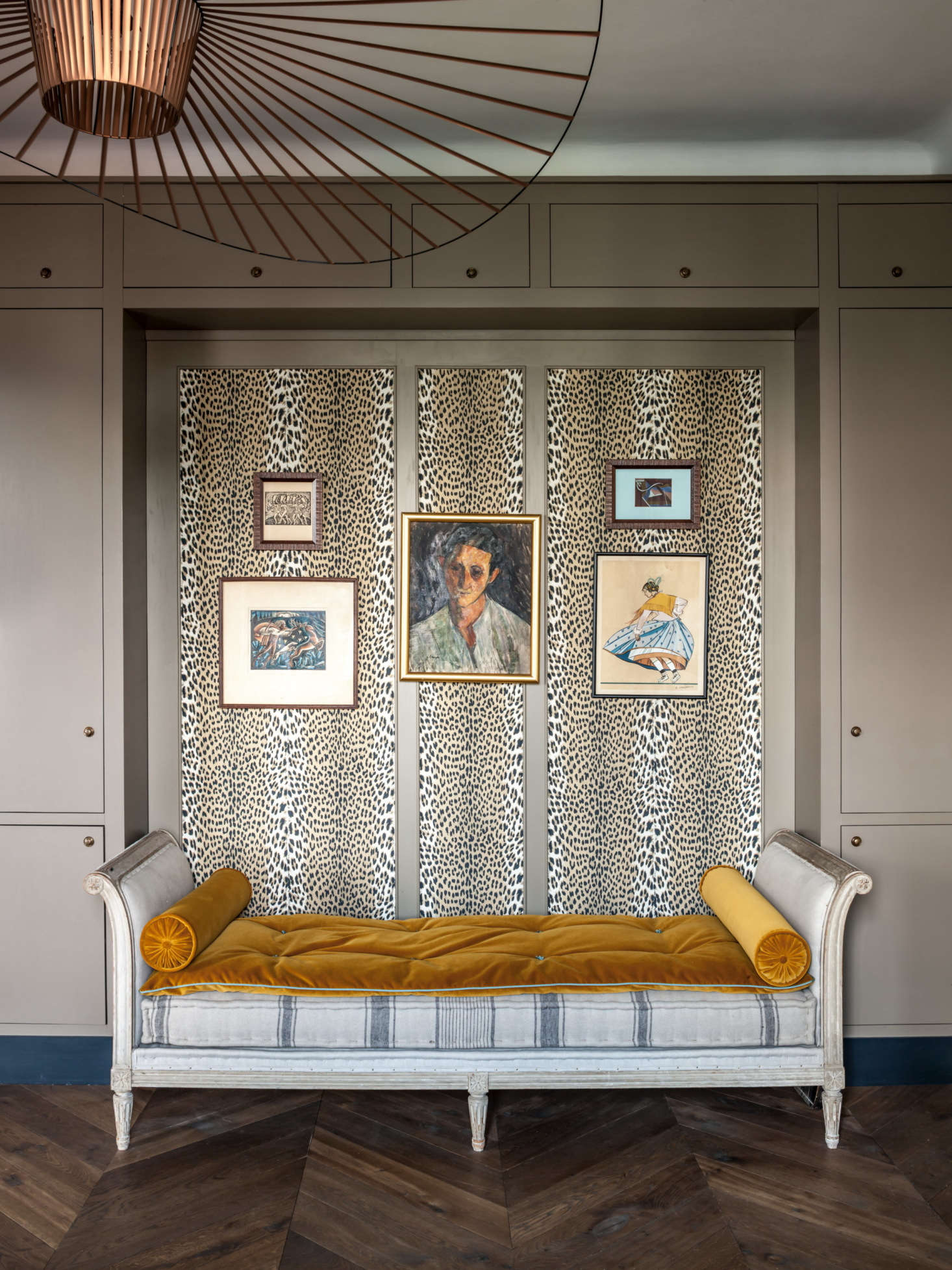 The antique daybed is another eBay find. Both the “panthère” wall fabric and the yellow velvet on the cushions are from Pierre Frey.