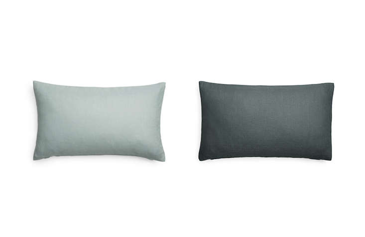 Arket carries a series of pillow covers in a variety of colors, like these Linen Lumbar Cushion Covers in pale green and grey (150 SEK each).