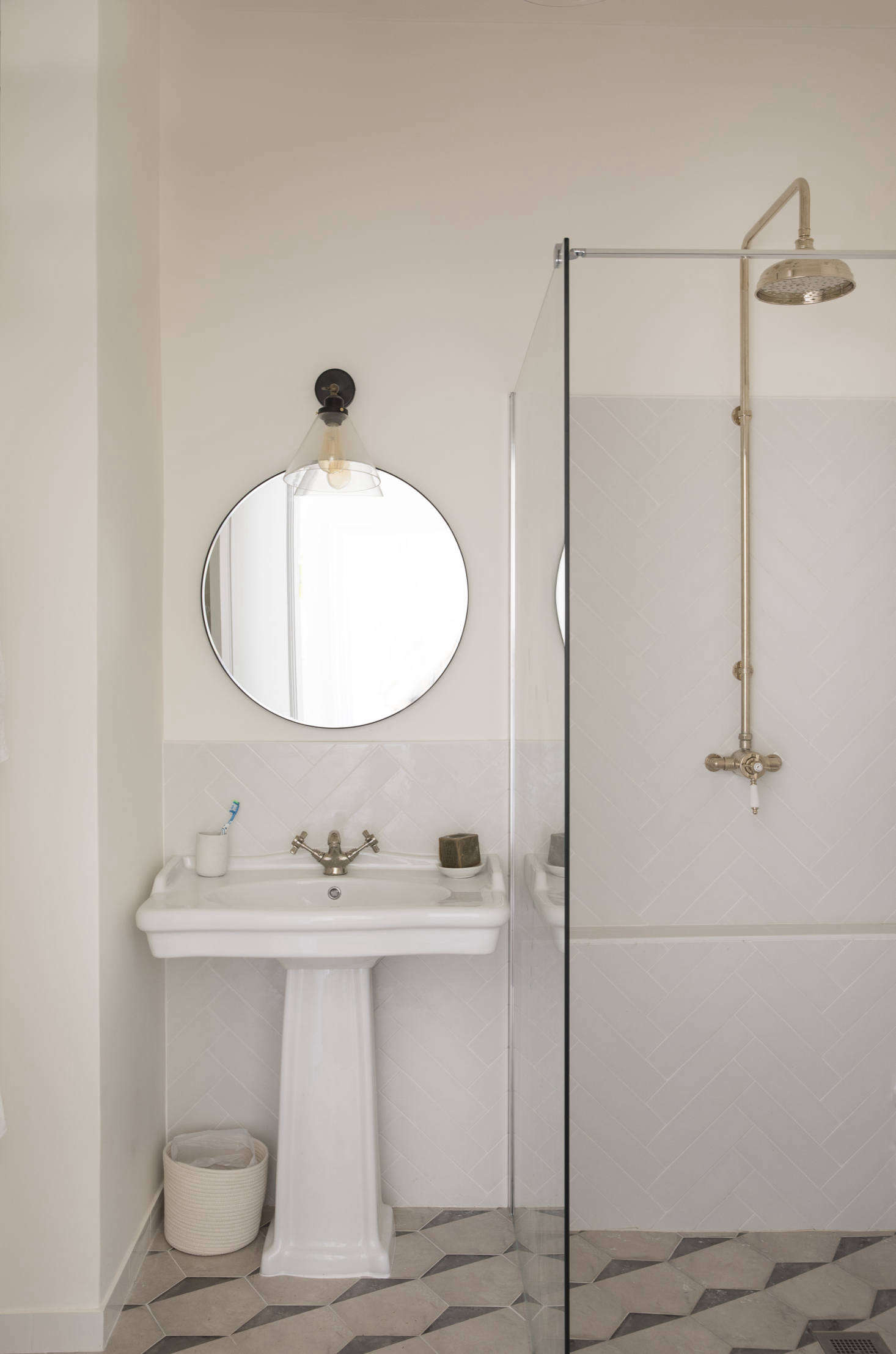“The apartment had an electric toilet when we bought it,” Helen says, “and we were told the floor was going to be too shallow to put in a proper plumbed toilet, but the plumber we had was brilliant and managed to do it.” The tiles are from Casaoikos. The shower and sink taps are from Sanctuary Bathrooms in the UK.