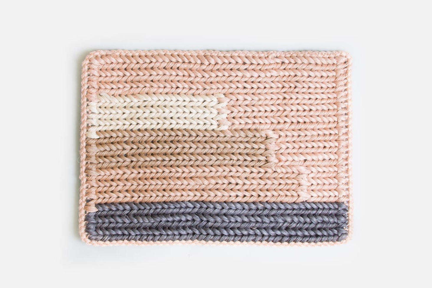 Hernandez, who was born in Colombia and has a degree in graphic design, starts her designs with a mood board, which ultimately informs her color palette. The Knotted Doormat in Guava is currently on sale for $0 on Someware.