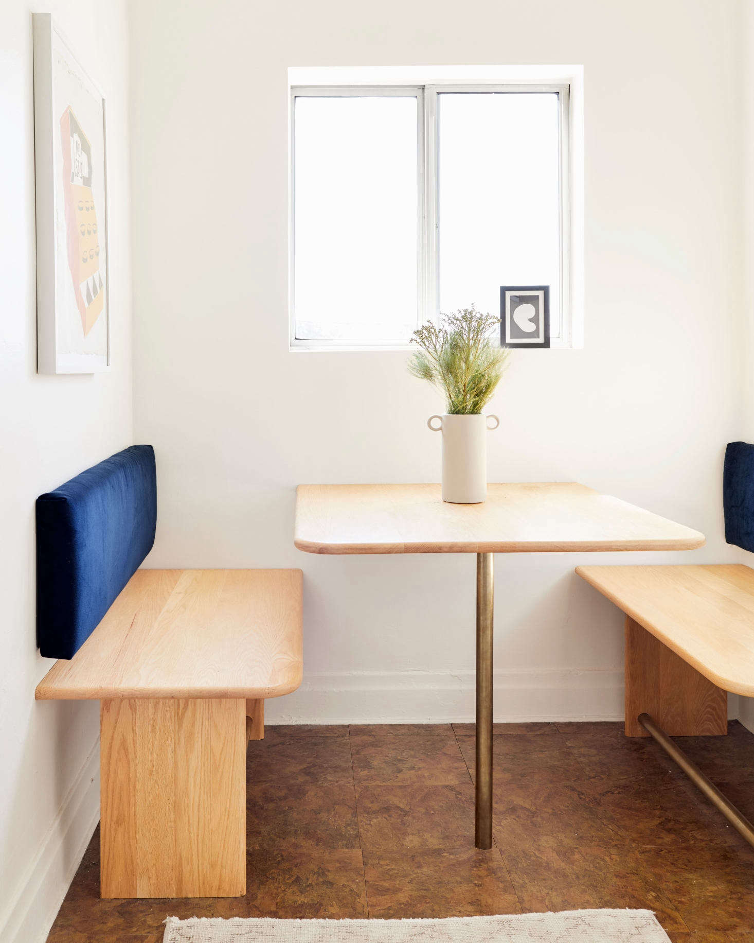 “After clearly looking at too many beautiful modern Parisian hotels and homes, I designed this guy,” says Jessica of her breakfast nook. “I wanted to utilize and maximize the space with a renter-friendly (minimal holes in walls) built-in instead of going for a table and chairs. This way, four people can eat at once here instead of two or maybe three.”