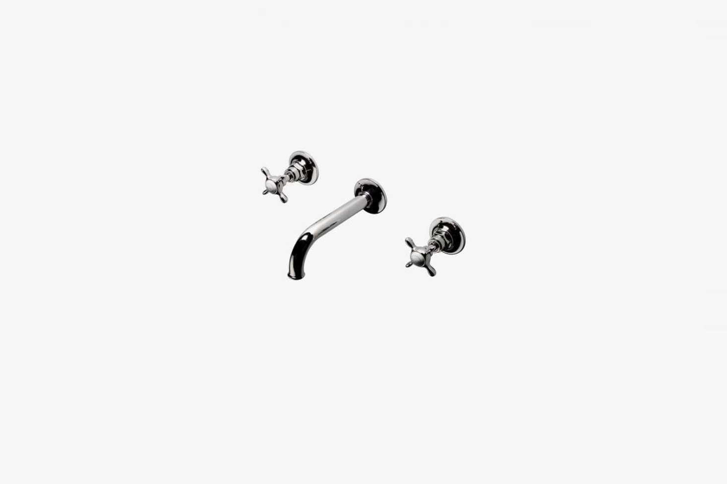 Another style from Waterworks, the Easton Vintage Low Profile Three Hole Wall-Mounted Lavatory Faucet with an elongated spout and metal cross handles. The faucet is available in data-src=