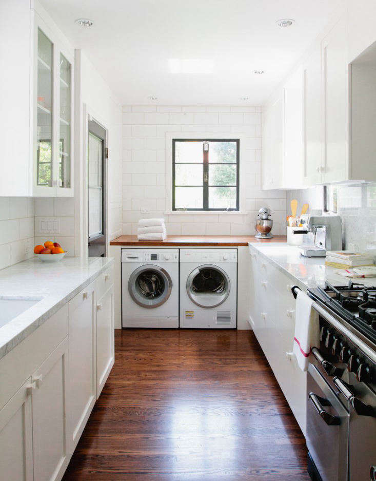 No laundry room? No problem. Check out 7 Ways to Sneak a Washer/Dryer Into the Kitchen for some inspiring solutions to a small-space conundrum. Photograph by Jessica Comingore.