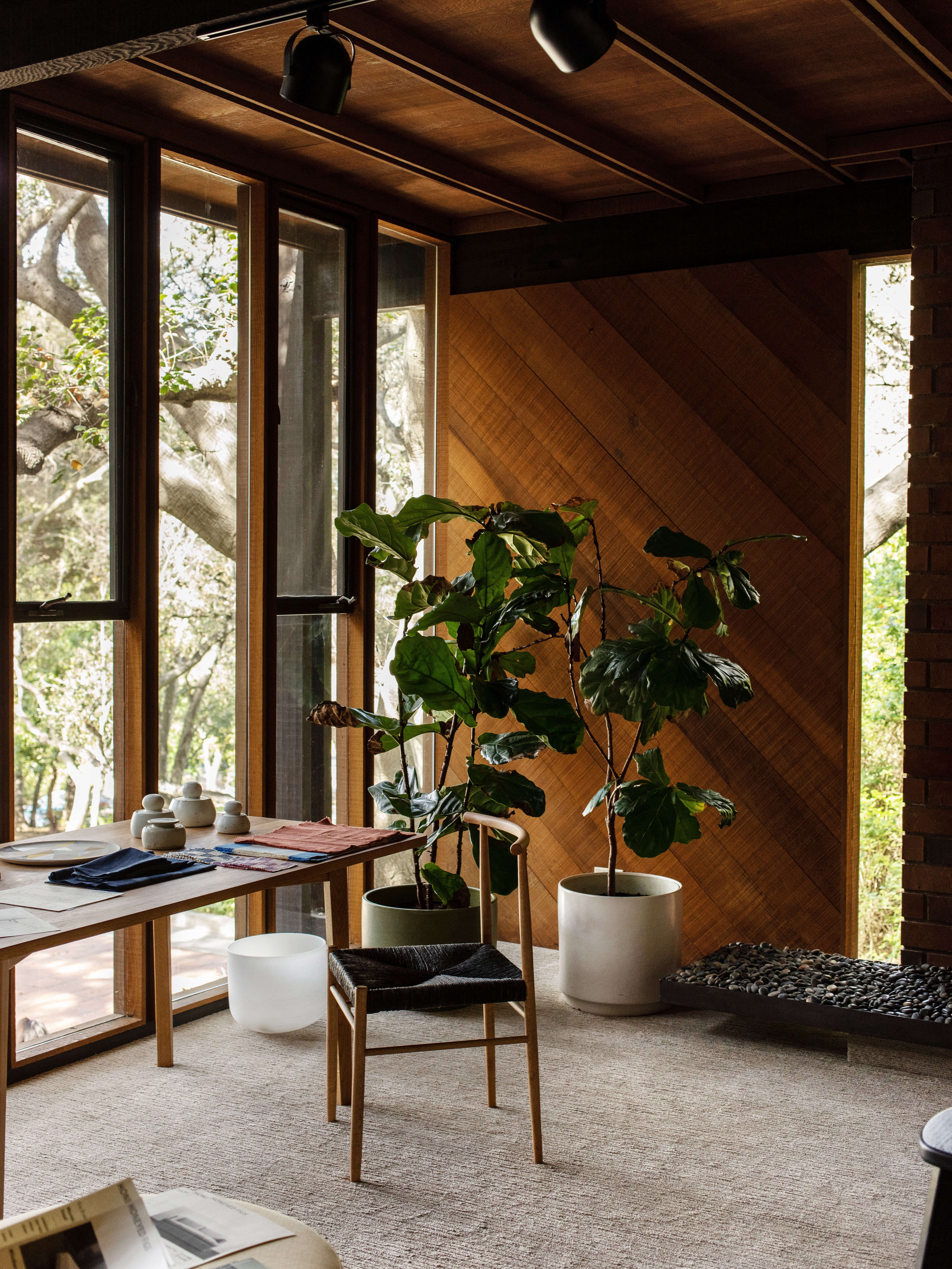 The 02 Chair with a black rush seat and the Dillon Table, both by EB Joinery.