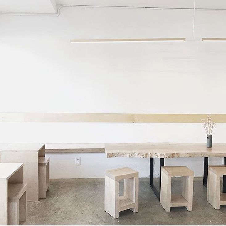 The wood furniture warms up the concrete flooring.