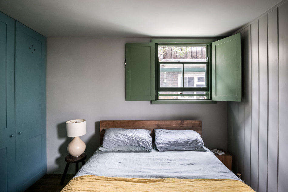 The green of the painted kitchen cabinets is repeated here on the shutters.