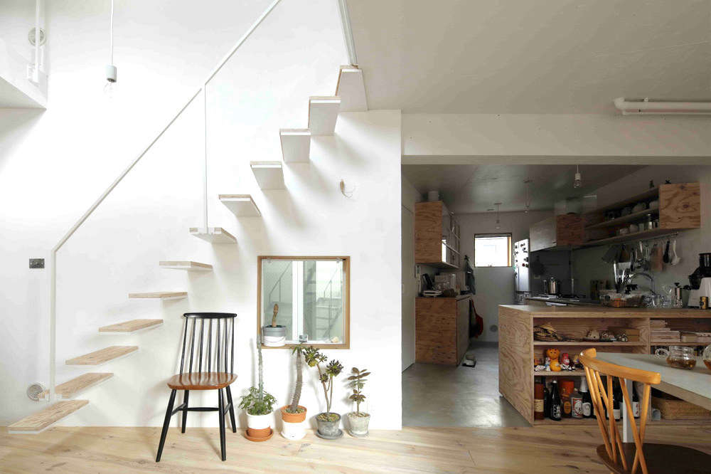 The floating design has pine-topped steel treads and a minimalist steel railing. Suffice it to say building codes are far less strict in Japan than they are in the US.