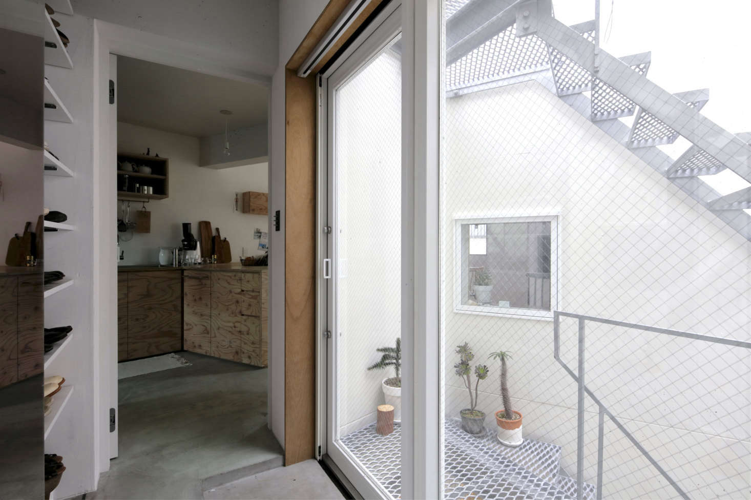 The loft-like third story houses the kitchen and living quarters.