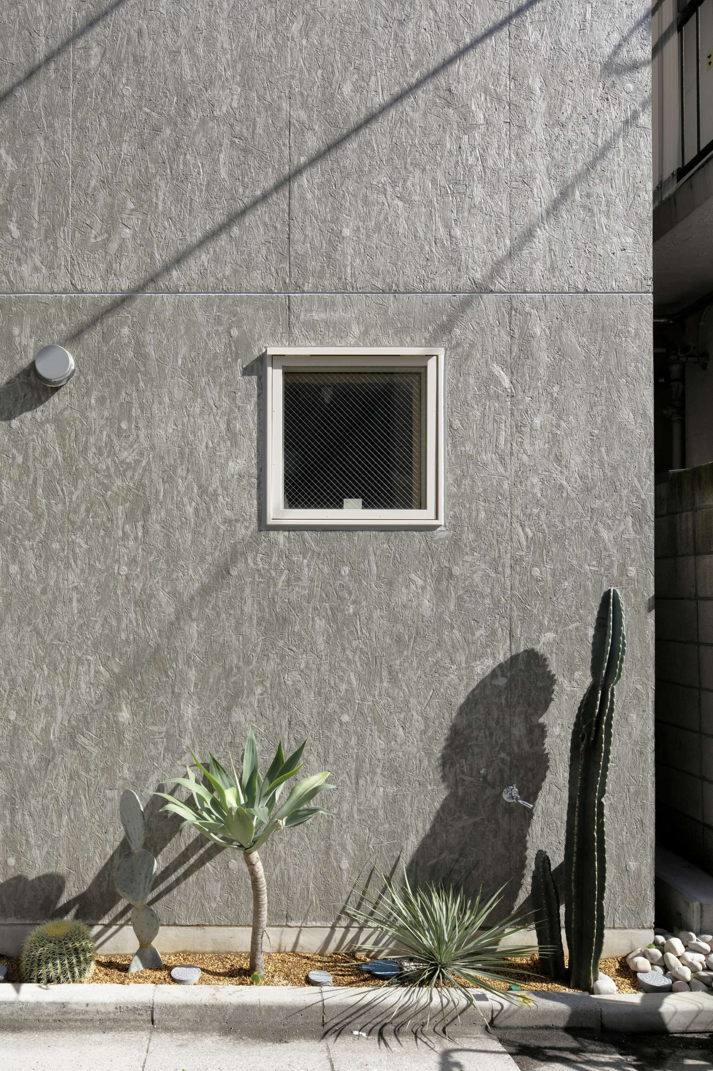 Viewed closeup, the oriented strand board adds texture and pattern to the exterior.