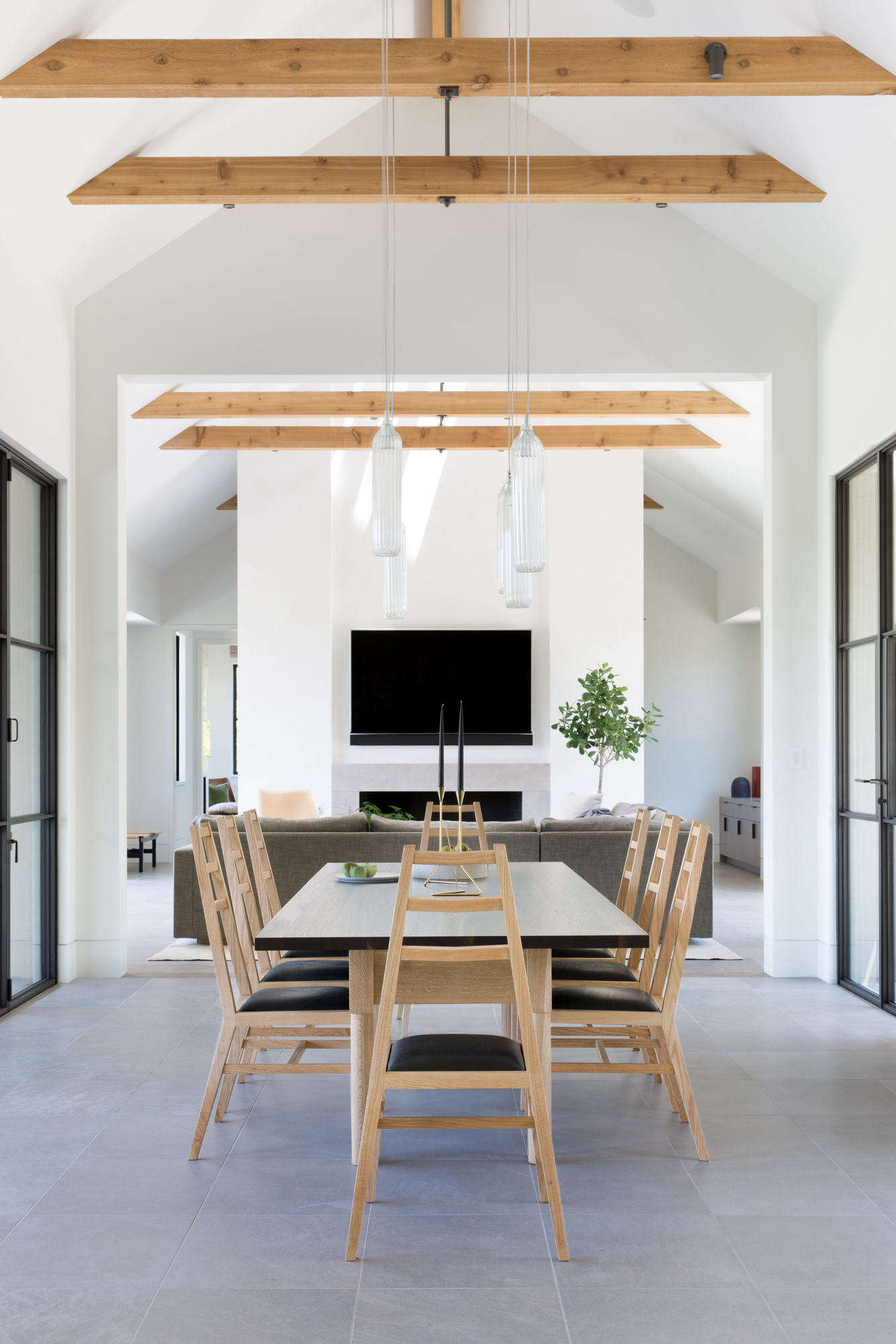 The dining area, with steel-frame doors on either side.