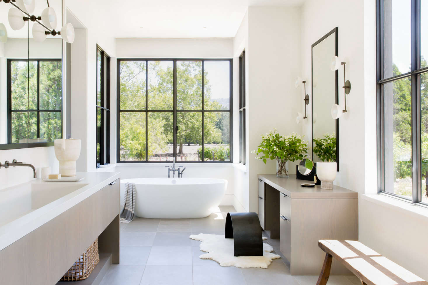 The bright master bedroom is anchored by a Victoria & Albert Barcelona Soaking Tub. 