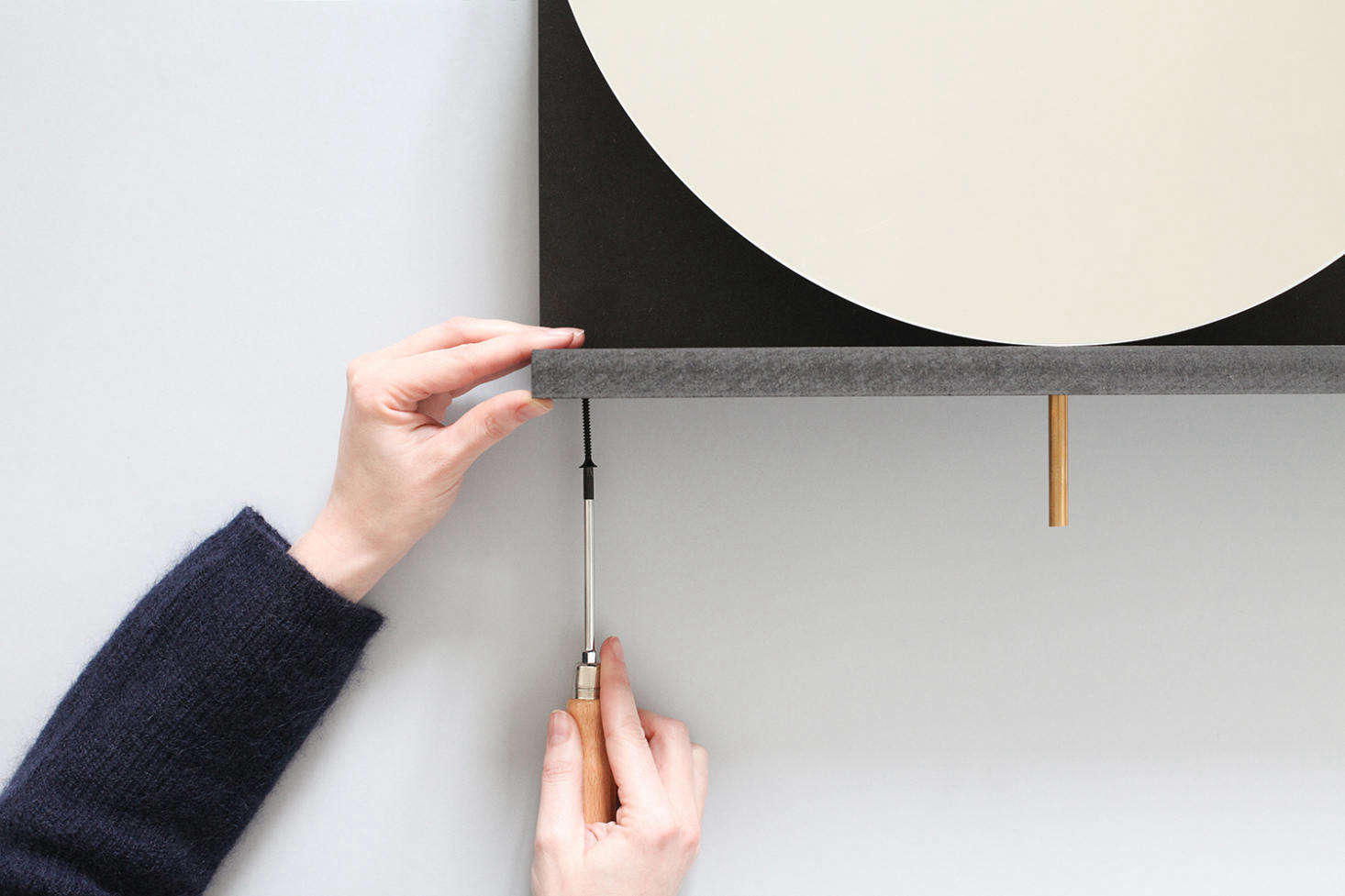 Thread the rod through the top and bottom panel holes and then screw the top panel into place.