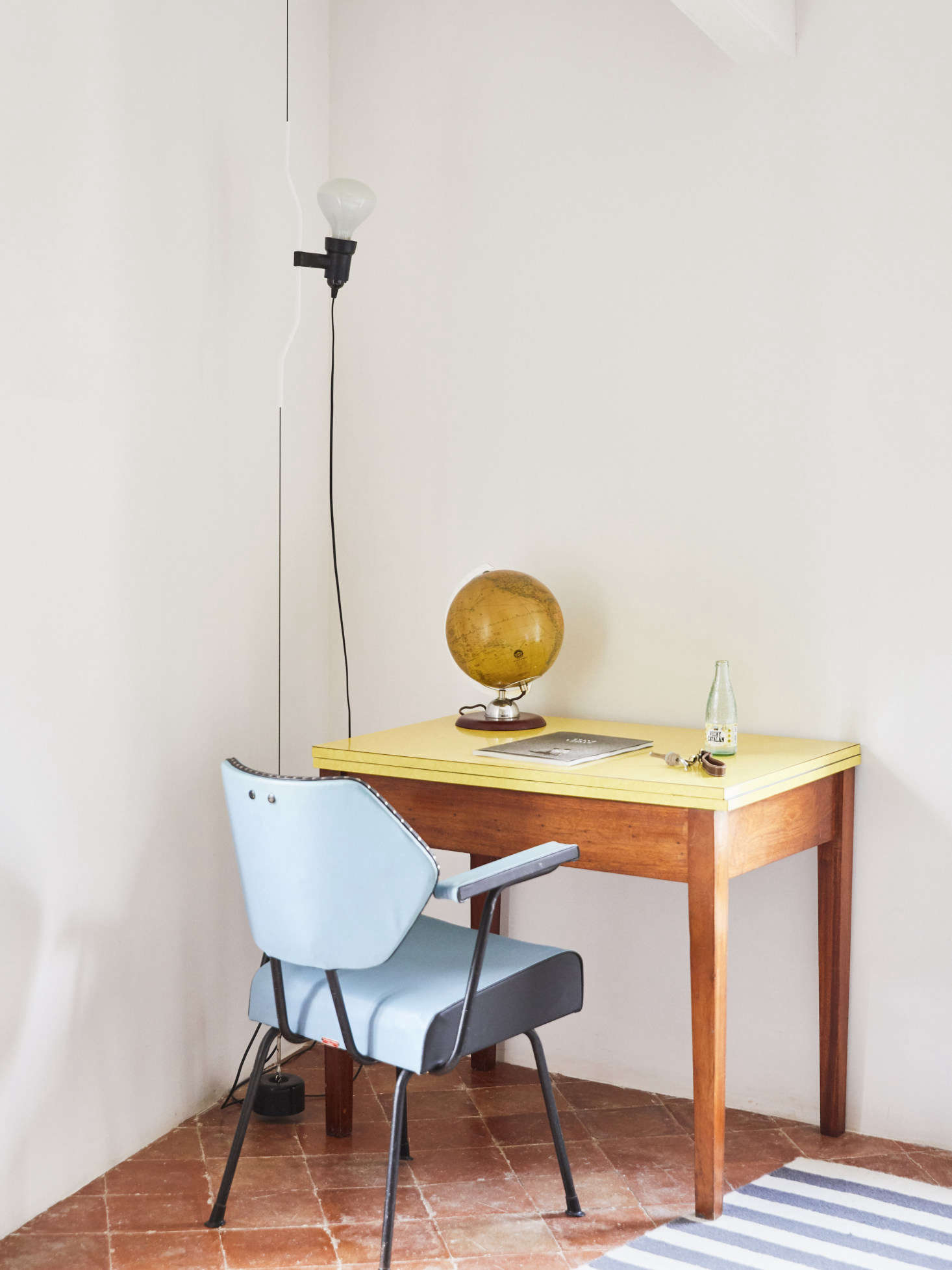 The desk is a vintage 60’s piece from Lannion in Brittany, and the chair, too, is vintage, sourced from Amapola Antiques in Madrid. The lamp is the Flos Parentesi Floor Lamp in white.