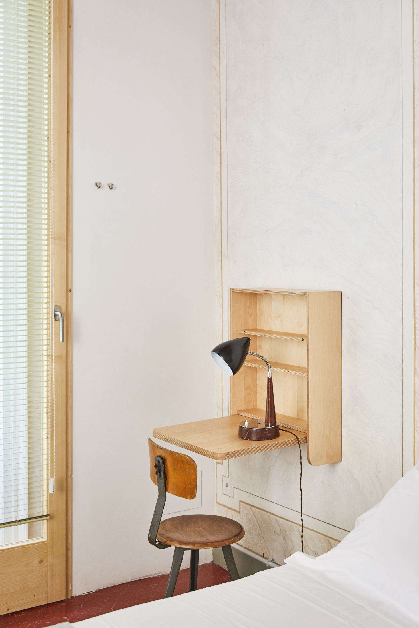 A folding desk and shelving was made custom from Marine-grade plywood.
