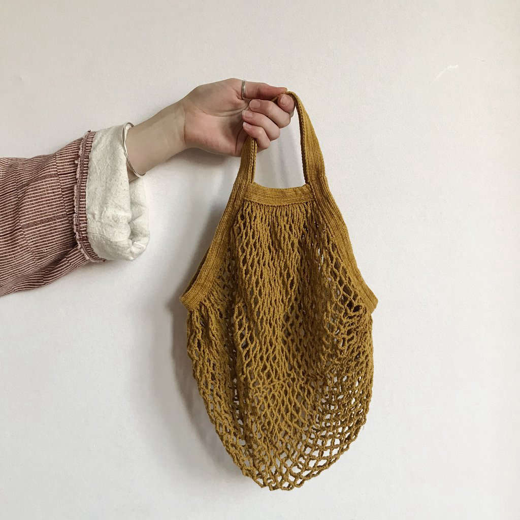 A Mustard Short-Handled String Bag is €.