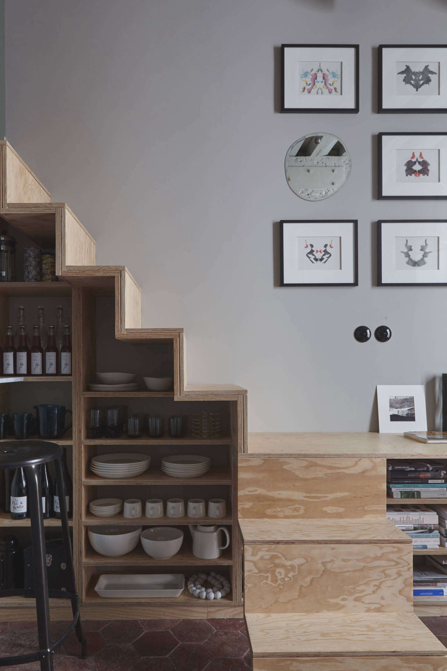 Note how the tabletop also acts as a step in the staircase, which itself leads to a sleeping loft.