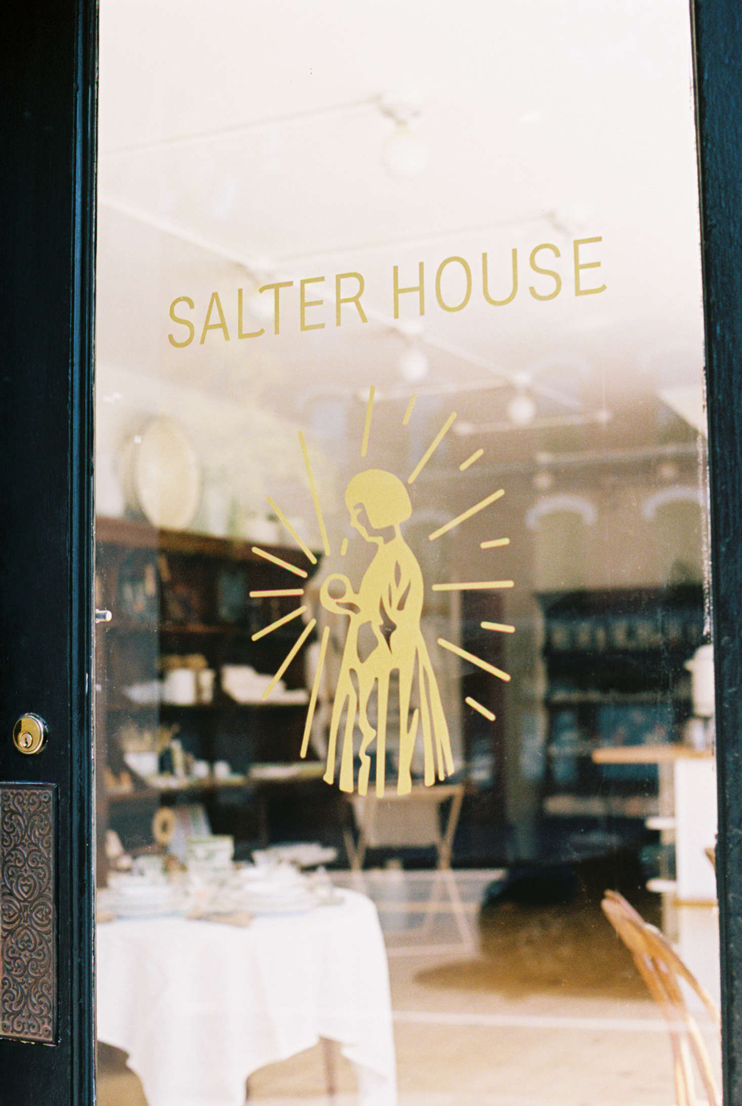 In the window, the shop’s logo: “adapted from a woodblock illustration by Cuala Press (an early 1900s women-founded and run printing press) that accompanied The Song of Wandering Aengus by W. B. Yeats. The print hung in my childhood friend’s home, I used to redraw it over and over,” Sandeep wrote on Instagram.