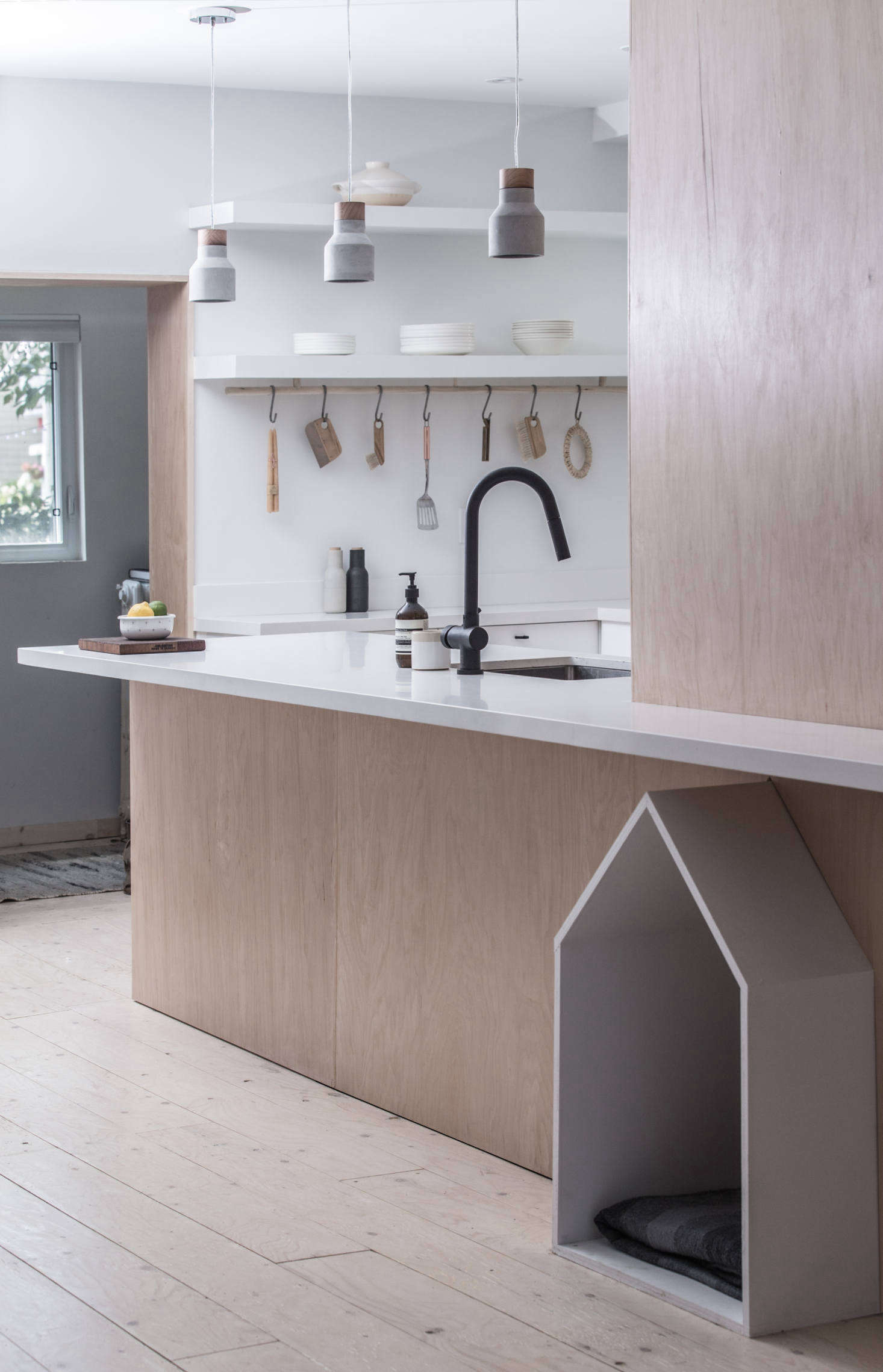 The matte black faucet is Vigo’s Gramercy pull-down design; $169.90 from Build.com. The hanging ceramic lights were supplied by the clients; for something similar see 10 Easy Pieces: Terracotta Pendant Lights.