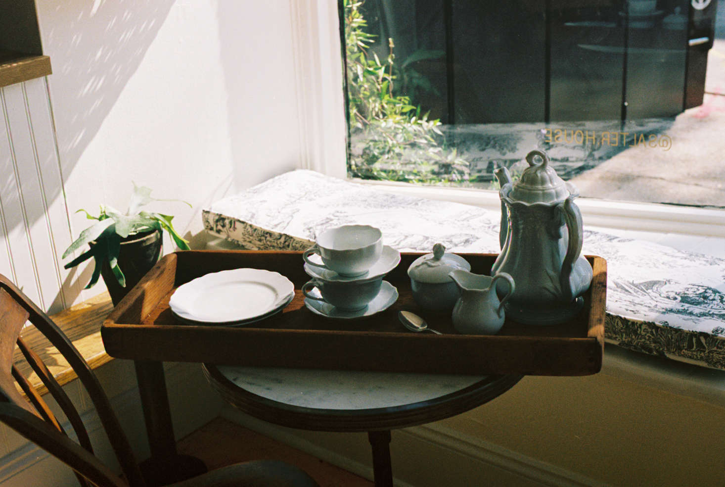 A detail of tea service, served in a sunny window seat. The shop is also entirely plastic free, and visitors will not find any waste baskets.