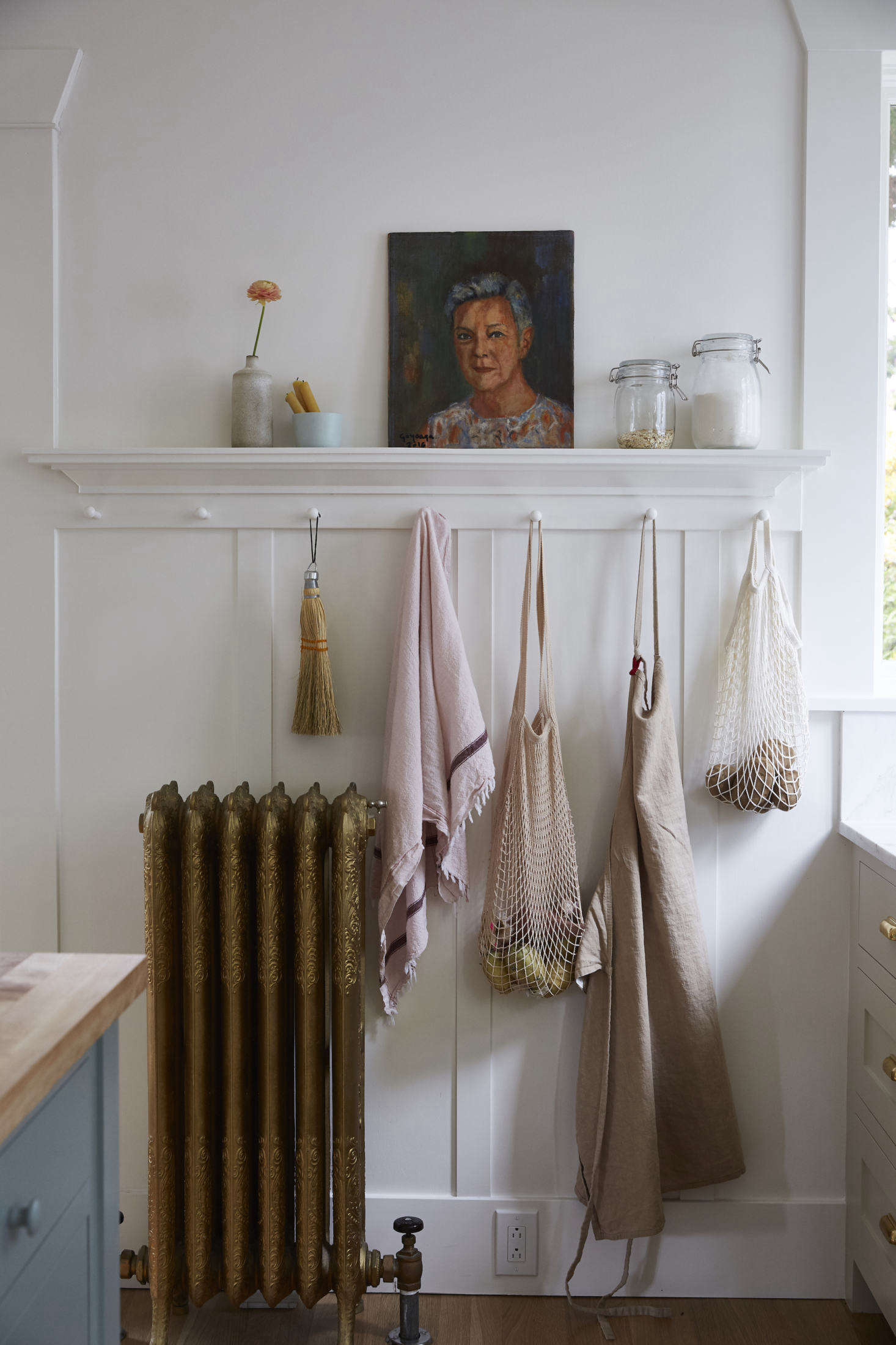 Aran is also a photographer and stylist, as evidenced by this picture-perfect moment in her kitchen. Propped against the wall is a painting, by her dad, of her aunt. 