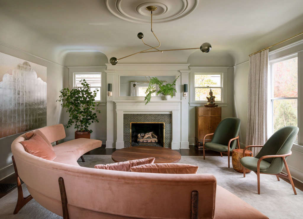 “The curved sofa in the living room was inspired by a Vladimir Kagan design that we then reinterpreted and custom made with the help of Master Furniture Makers and Trio Upholstery,” says the designer. The Neva lounge chairs are by Artisan and the ceiling light is by Shanghai-based Neri & Hu. On the walls is Benjamin Moore Gray Mirage.