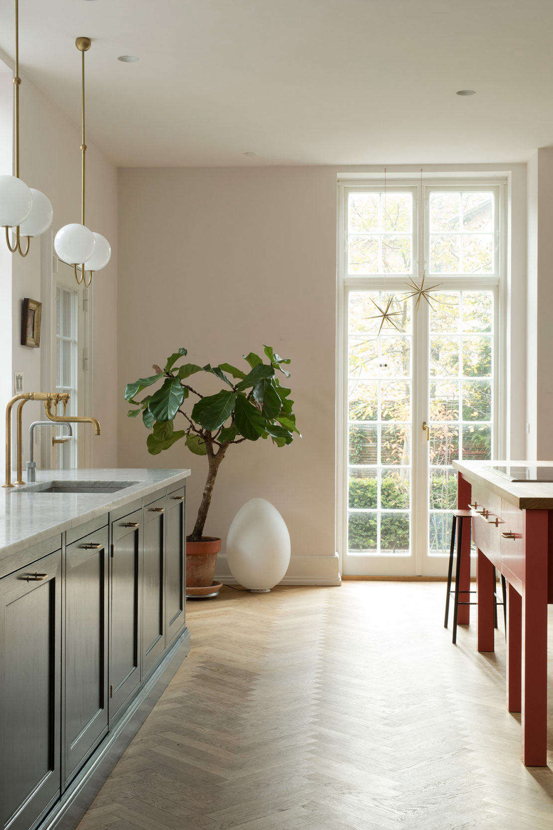The room is painted Nights in White Satin, a color from Danish firm File Under Pop that changes in the Nordic light from a warm white to palest pink (for similar shades, see Architects